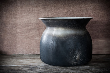 still life Old steaming pot on wooden background..
