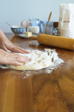 Kneading the yeast dough by hand. Selective focus