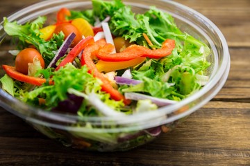 Healthy bowl of salad on table