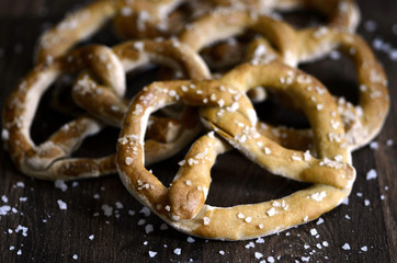 Salted Fresh Dough Pretzels on Dark Rustic Wood Table