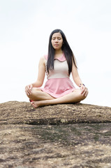 Fototapeta na wymiar Woman meditation on the mountain.