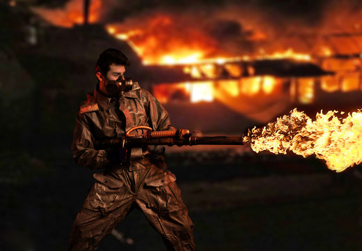 Soldier with flamethrower. Fire city background