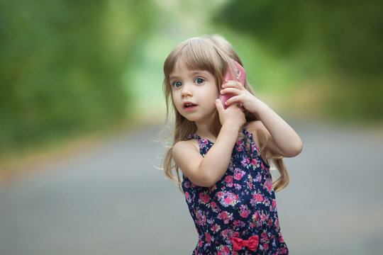 little girl talking on the phone