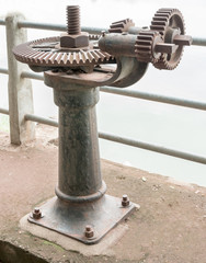 old rust gear of sluice