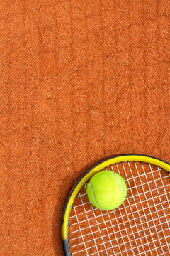 Sport background with a tennis racket and ball. Vertical image.