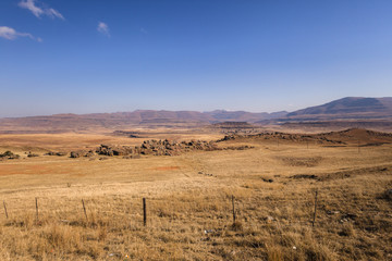 Naklejka premium Mountains Tribal Habitat Homes scattered over the landscape