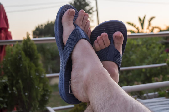  Feet in blue flip flops in summer