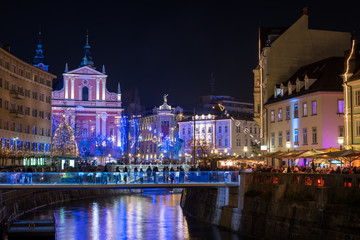 Fototapeta na wymiar Decorated Ljubljana for New Years holidays, panorama Panorama of St. Francis church and Preseren square, decorated for Christmas and New Years holidays, Ljubljana, Slovenia