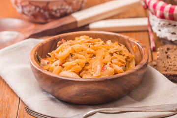 Cabbage stewed  in portions wooden plate
