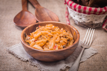 Cabbage stewed  in portions wooden plate