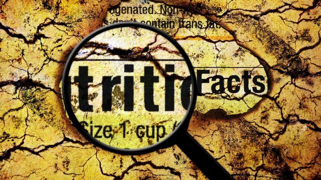 Magnifying glass on nutrition facts 