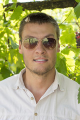 Handsome man portrait in vineyard