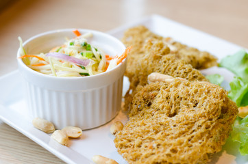 Spicy Crispy Catfish in white plate