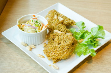 Spicy Crispy Catfish in white plate