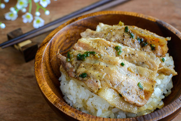 Salt and black pepper grilled pork with Japanese Rice in wooden