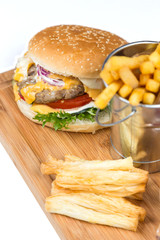 burger with fried potatos in bucket