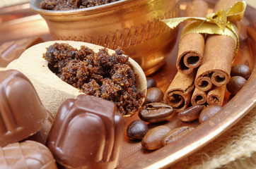 Brown sugar, cinnamon sticks and coffee beans, chocolate candy 