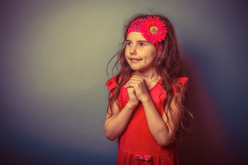 a girl of seven European appearance brunette in a bright dress f