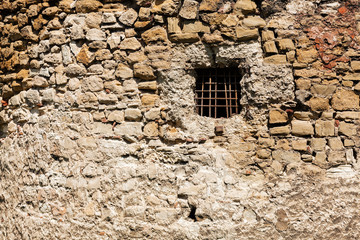Fototapeta na wymiar old stone wall with window
