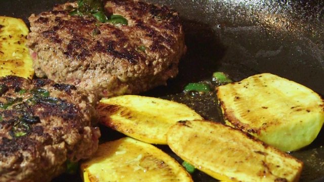 Cooking hamburger meat ground beef in hot frying pan on stovetop