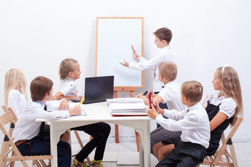 The group of teenagers sitting in a business meeting