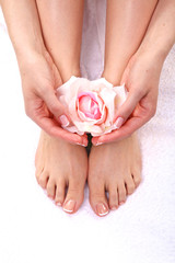 pedicure on legs and beautiful manicure on hands closeup