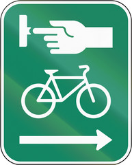 Road sign in Canada, instructing cyclists to use the crosswalk signal. This sign is used in Quebec