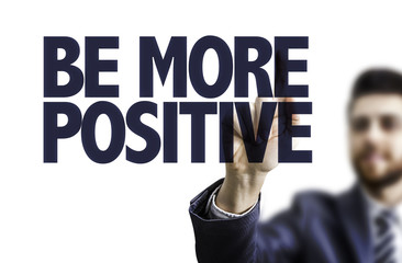 Businessman pointing the text: Be More Positive