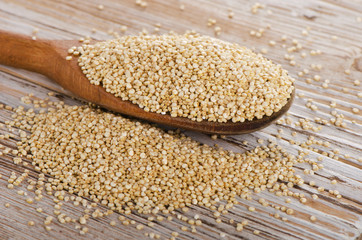 Quinoa seed on  rustic  wooden background.