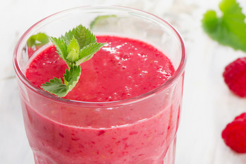Fresh Raspberry smoothie for breakfast on  white table.
