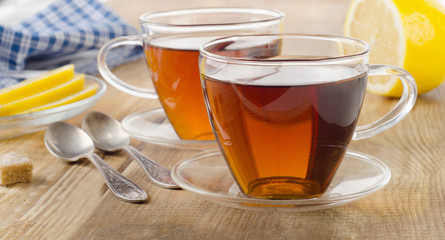 Glass cups of fresh black tea.