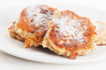 Cottage cheese pancakes with sugar powder.