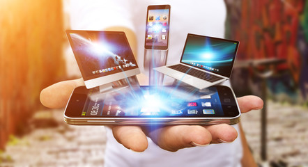 Businessman holding tech device in his hand