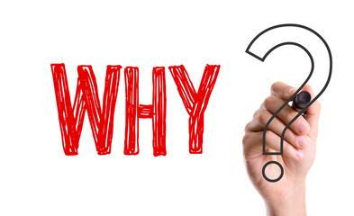Hand with marker writing the word Why?