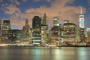 Skyscrapers in Manhattan at night, New York City. View from Brooklyn heights.