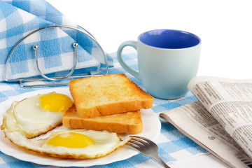 Breakfast with crunchy toasts Coffey and newspaper