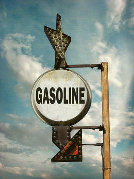 aged and worn vintage photo of gasoline sign