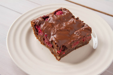 Brownie with raspberries