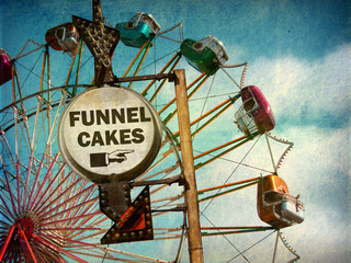 aged and worn vintage photo of funnel cakes sign at carnival