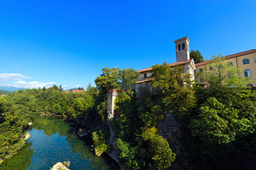 Fototapeta na wymiar Natisone River in Cividale del Friuli - Italy / Natisone River, view of Devil's bridge in the medieval town Cividale del Friuli, Udine, Friuli Venezia Giulia, Italy
