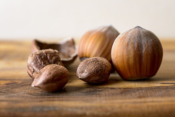 hazelnut and nutshell on wood