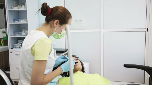 Oral hygiene and dental care: Doctor dentist working with patient in dental clinic. Slider movement left to right