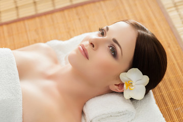 Young, beautiful and healthy woman in spa salon. Traditional oriental therapy and beauty treatments.