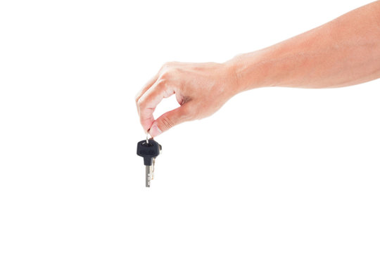 Keys in hand isolated  white.
