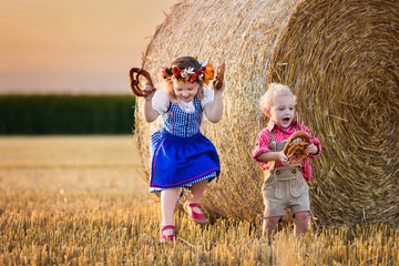 Kids playing in wheat field in Germany