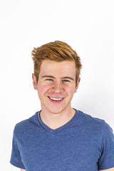 Obraz premium cool boy with red hair posing in studio
