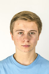 Obraz premium cool boy with blue shirt posing in studio