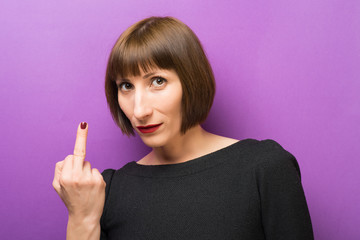 Obraz premium portrait of a woman lips index finger