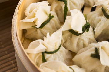 Chinese dumplings in bamboo steamers