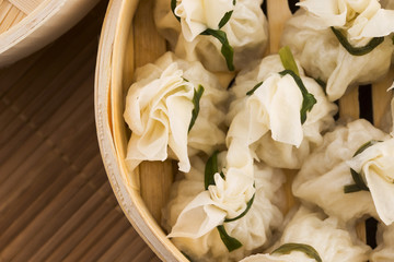 Chinese dumplings in bamboo steamers